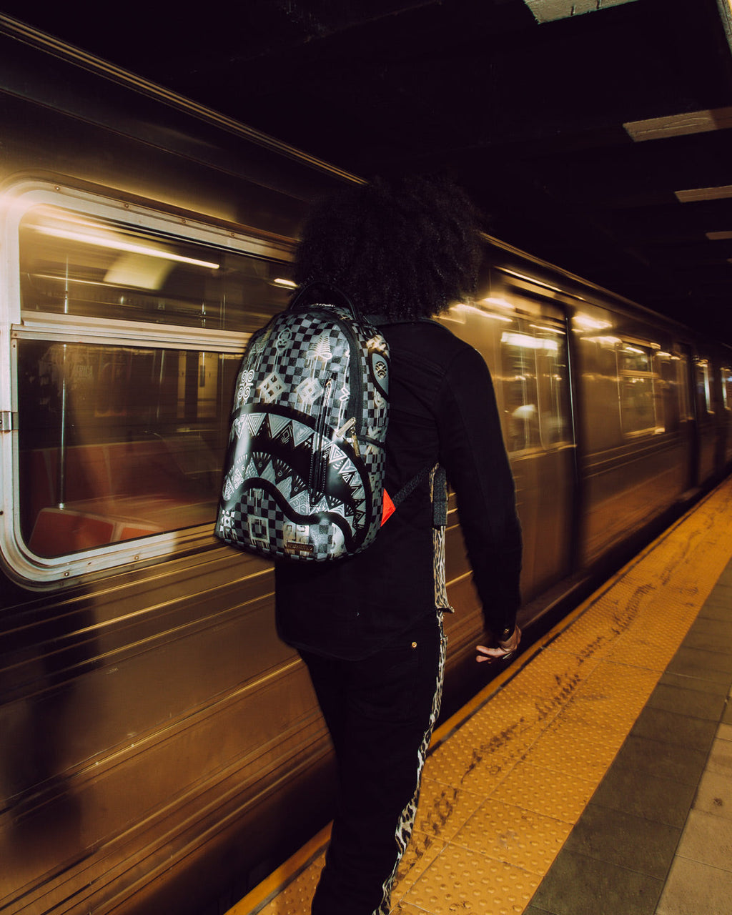 AFRICAN INTELLIGENCE 9 POWER GLYPHICS BACKPACK - SANDFLOWER COLLAB